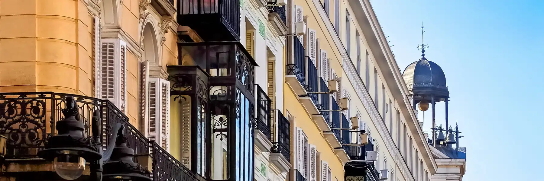 Warm stone facade of a traditional Madrid building