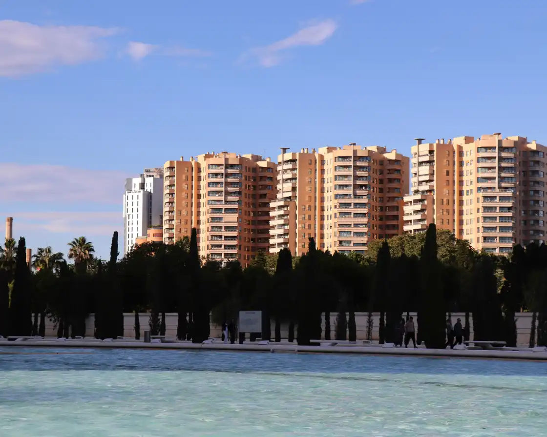Modern residential towers rising above trees in Valencia
